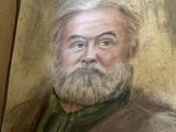 un tableau représentant un homme barbu vêtu d'une chemise verte