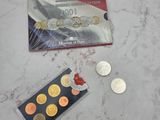 a card and some coins on a marble table