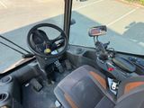 a view of the driver ' s seat of a bus from the driver ' s seat