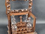 a small wooden table with a mirror on top of it