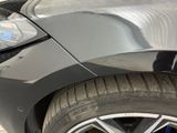 a close up of a car ' s front bumper and tire
