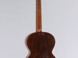 an old guitar hanging from the ceiling