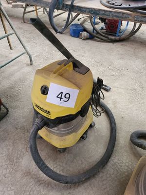a yellow vacuum that is sitting on the ground