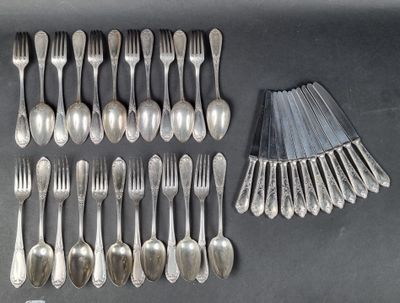 many forks and spoons laid out on the table