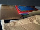 a cardboard box with books in it sitting on a table