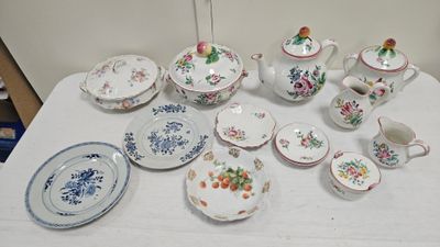 a table with many different types of china on it