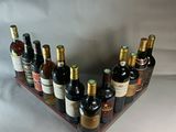 many bottles of wine in a wine rack on the table