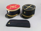 two hats that are sitting next to each other on a table