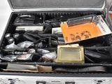 a metal case filled with tools and other items