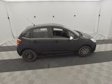 a picture of a small black car in a garage