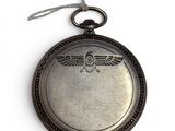a silver pocket watch with a picture of an eagle on it