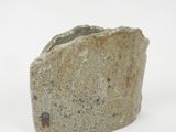 a rock that is sitting on a white surface