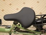 a close up of a bicycle with a seat on it