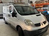 a white van parked in a garage next to other cars