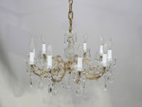 Lustre en verre et laiton à dix bras de lumière, à décor de …