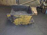 a yellow box sitting on top of a pallet in a garage
