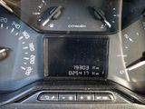 a close up of a car dashboard with a clock on it