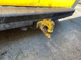 a close up of the rear end of a yellow truck