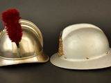 two helmets that are sitting next to each other on a table