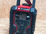 an image of a portable radio with a cord on top of it