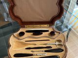 a case that has a set of knives and spoons in it