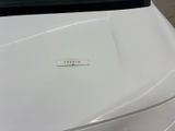 a sticker on the hood of a white car