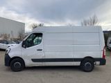 a white van parked in a parking lot with other cars