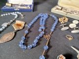 a table with a bunch of jewelry on it