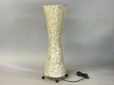 a white vase that is sitting on a table