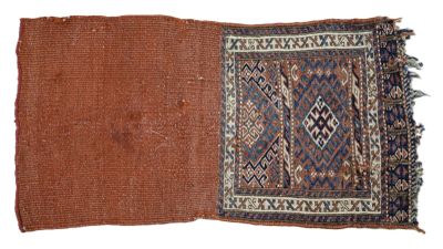 a close up of a brown and blue rug on a white surface