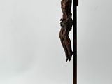 statue of a man on a cross with a horse and a man on a horse