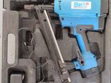 a blue and black air nail gun in a black case