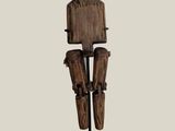 statue of a man with a wooden head and legs