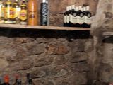 many bottles of beer on the shelves in the room