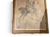 painting of a man on a horse in a box on a white surface