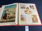 an open book with pictures of people on it on a table