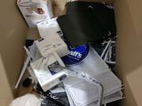 a cardboard box full of electronic devices and other items