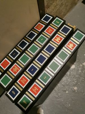 three boxes with stamps on them sitting on a table