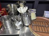 many pots and pans that are on a table