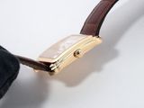 a close up of a wrist watch with a brown strap