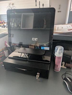 a laptop computer sitting on top of a desk with a mouse