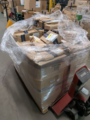 a large pile of boxes sitting on a pallet in a warehouse