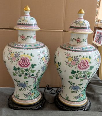 two vases that are sitting on a table