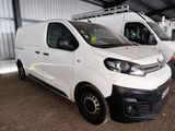 a white van that is parked in a garage