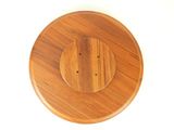 a wooden plate with a hole in the middle of it