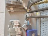a metal shelf with many items on it in a room