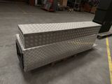 a large metal box sitting on a pallet in a warehouse