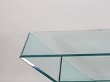 rectangular glass coffee table with a metal base and a glass shelf