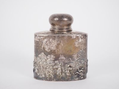 an image of a silver glass jar with a lid on a white surface