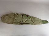 a green bag that has a pair of shoes on it